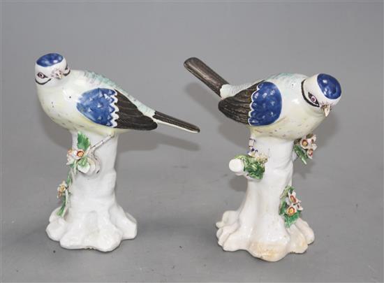 A pair of Derby figures of blue tits on tree stumps, c.1765-70, height 11.7cm and 11.5cm